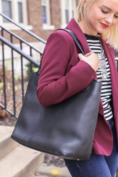 A leather tote matches casual and formal workwear as demonstrated by Poor Little It Girl.
